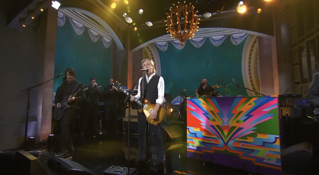 Paul singing and playing the guitar for SNL 50